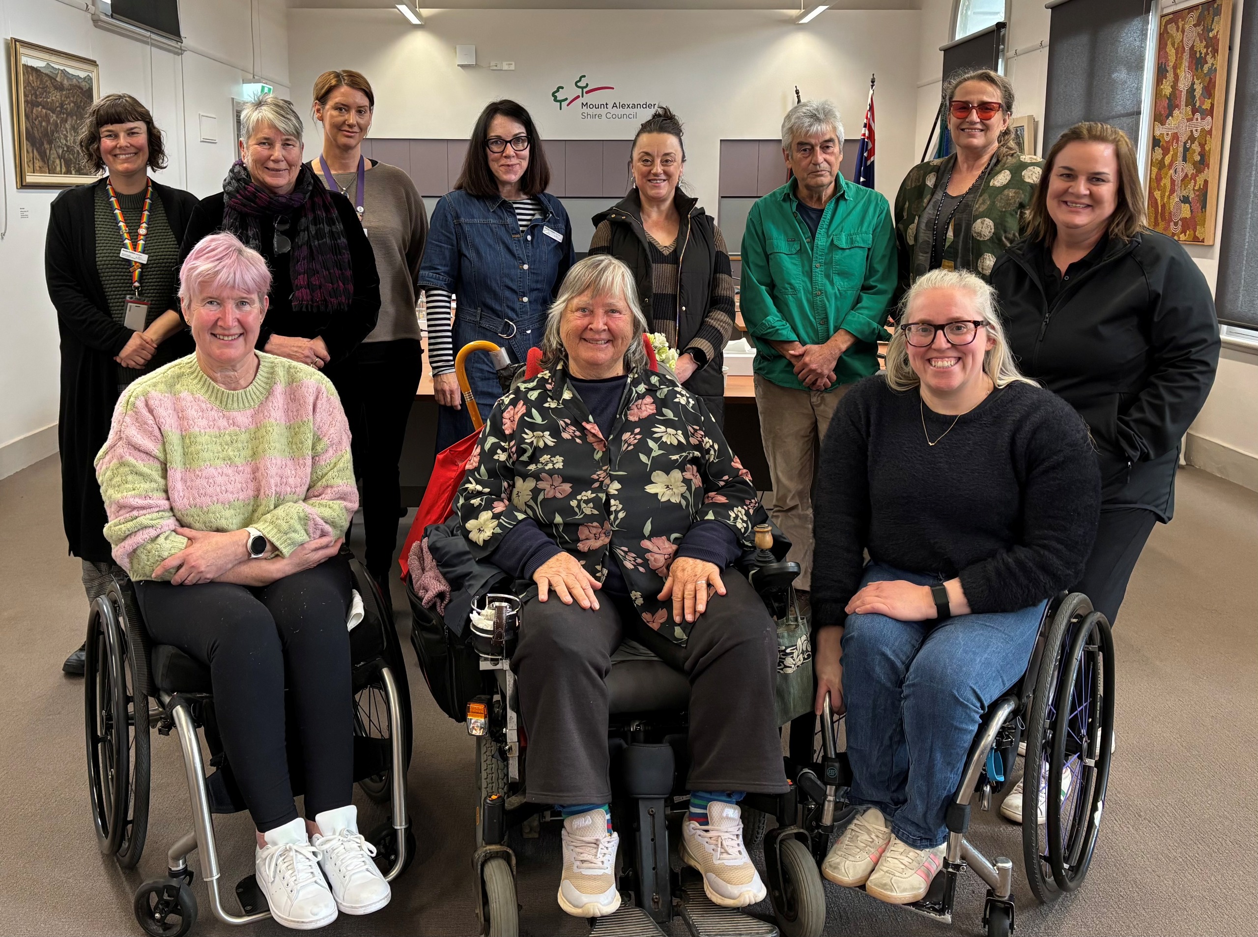 A group of people looking at the camera smiling